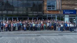 Attendees of the 60 Years of Ecological Sciences event pose for a group photo outside the Noreen and Kenneth Murray Library.