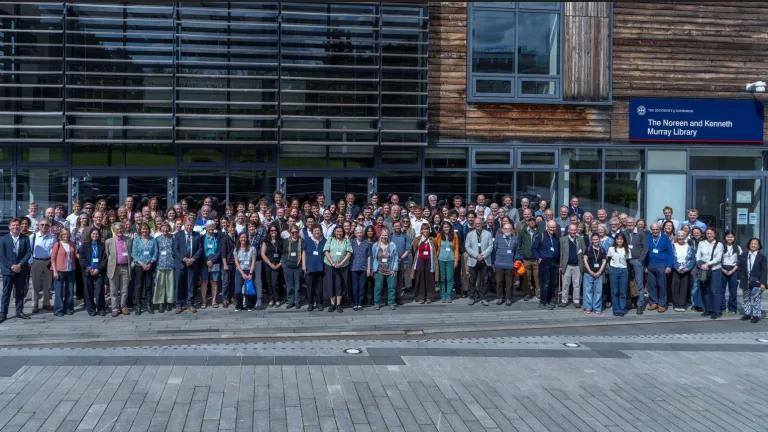 Attendees of the 60 Years of Ecological Sciences event pose for a group photo outside the Noreen and Kenneth Murray Library.