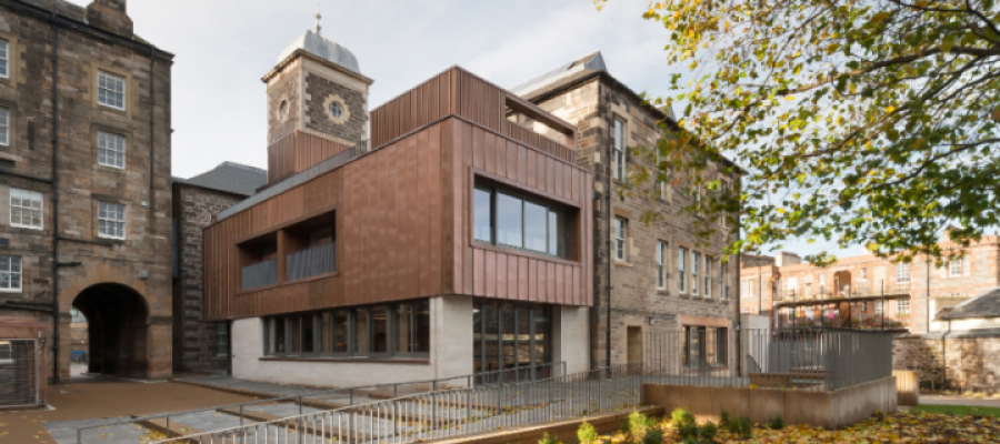 An outside view showing a modern timber and glass structure of the ECCI building