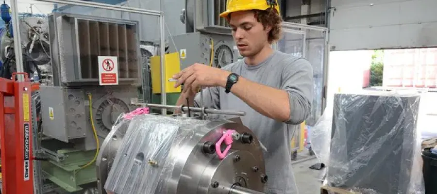Student working in industrial setting