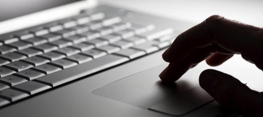 Close up view of a person using a laptop