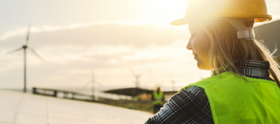 Women in hard hat at a windfarm
