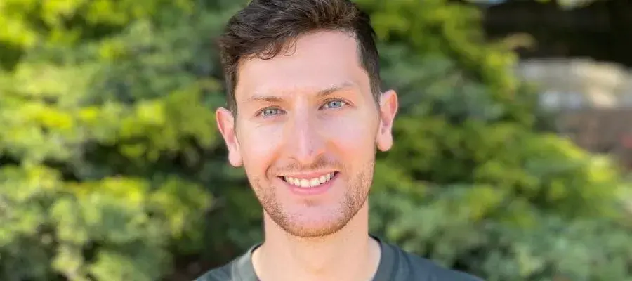 Portrait photo of Ross smiling at the camera