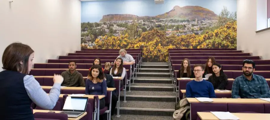 Students sitting in the Hutton Lecture Theatre watching a lecture.