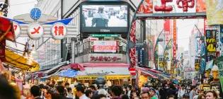 A Japanese streetscape full of people and signs