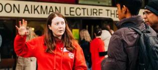 student ambassador at an open day talking to a member of the public