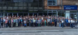 Attendees of the 60 Years of Ecological Sciences event pose for a group photo outside the Noreen and Kenneth Murray Library.