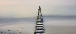Image of stepping stones stretching out to the sea