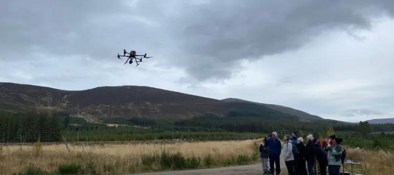 Students during field work using a drone