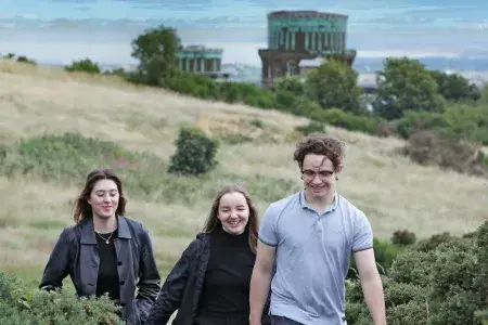 Students walking up Blackford Hill