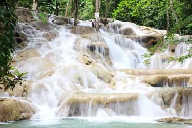 A multi-tiered waterfall in a tropical forest