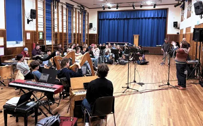 Young musicians from Sgoil Chiùil na Gàidhealtachd and Fèis Spè performing Of the Land at Plockton High School