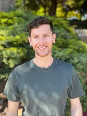 Portrait photo of Ross smiling for the camera