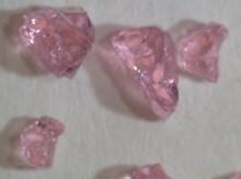 A cluster of pink dry gels of rare earth glass