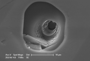 A 3D analysis pit image of a material sample using Secondary Ion Mass Spectrometry (SIMS) 